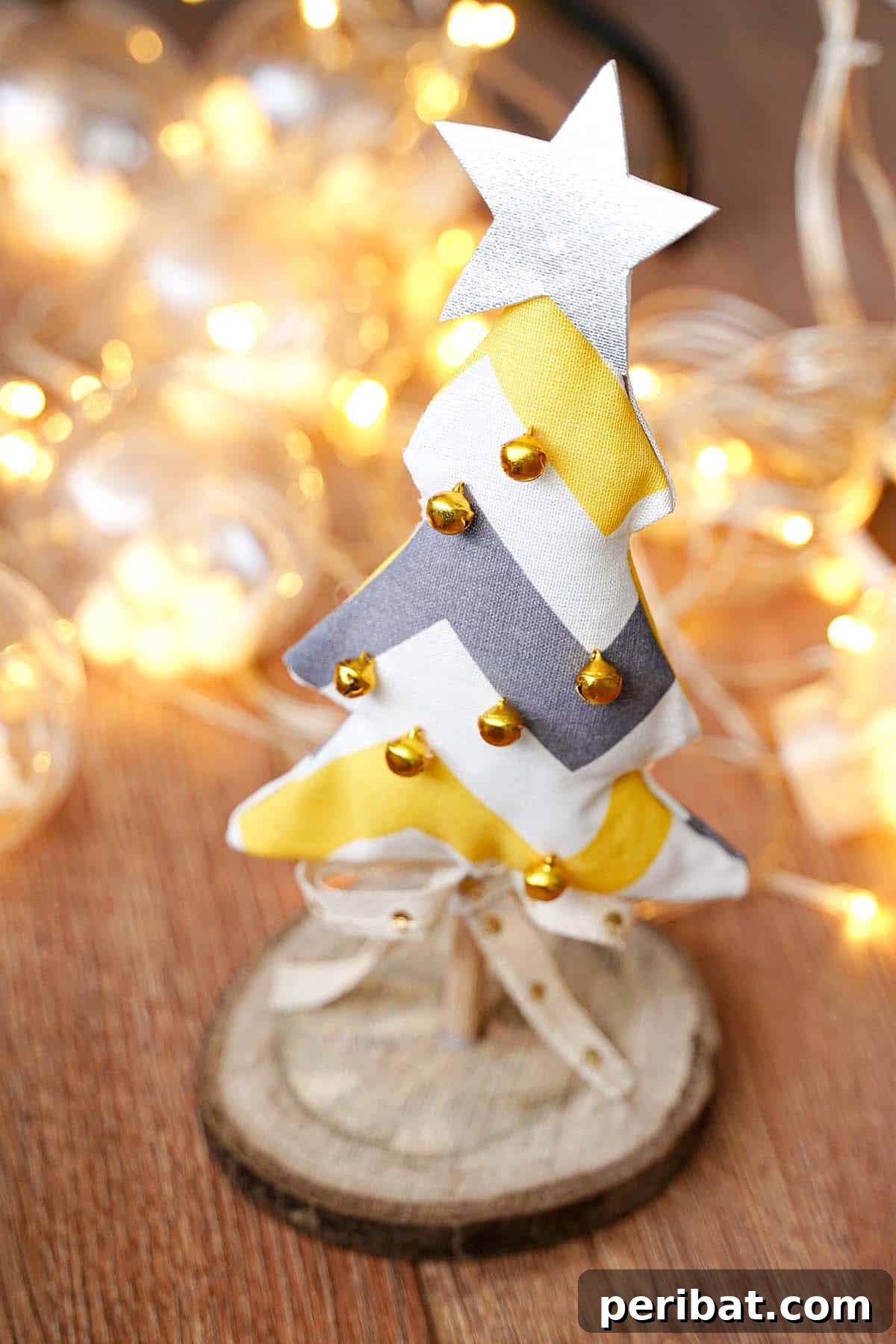 Charming Fabric Tabletop Christmas Tree Craft 11 Close-up of three mini fabric Christmas trees with varied textures and decorations