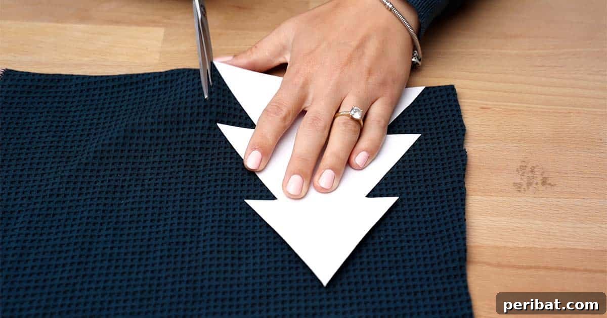 Charming Fabric Tabletop Christmas Tree Craft 5 Cutting fabric for mini Christmas trees using a cardboard template