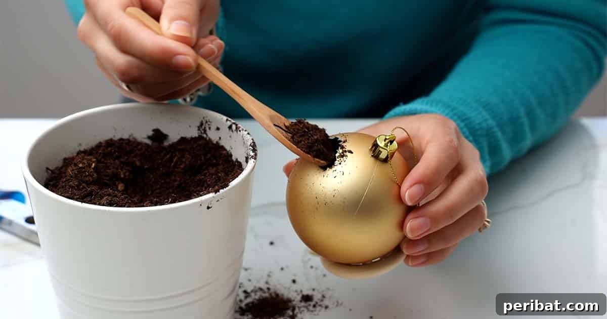 Crafting Festive Succulent Baubles 6 The process of how to turn a Christmas ornament into a succulent planter, focusing on attaching the base.