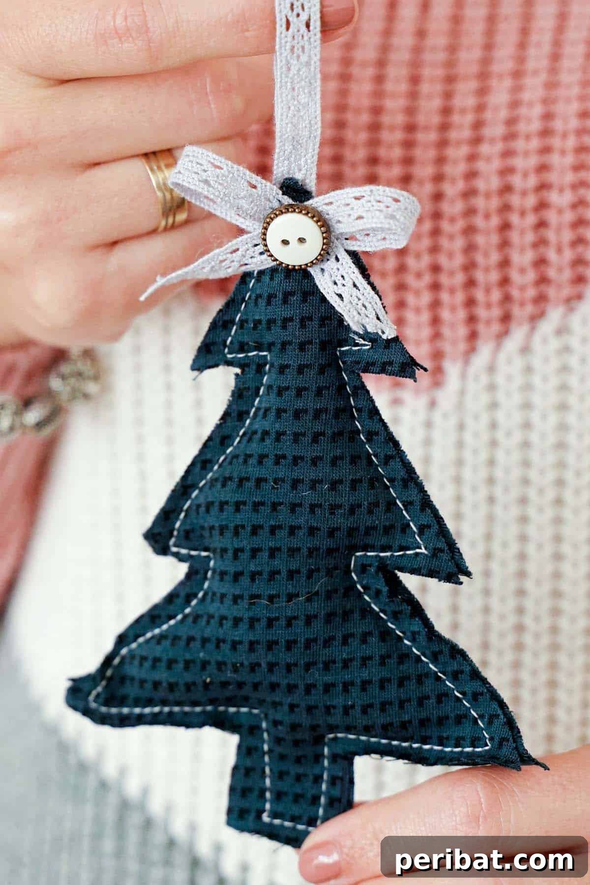 Beautiful handcrafted DIY Fabric Christmas Tree Ornaments displayed on a branch