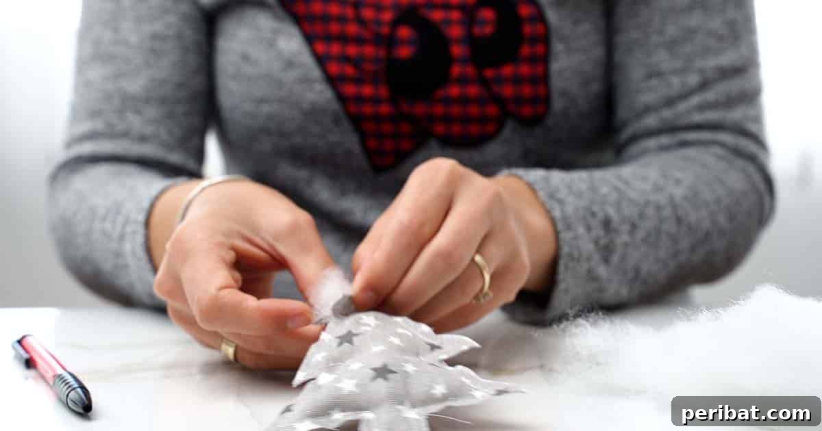 Stuffing and closing the fabric Christmas tree