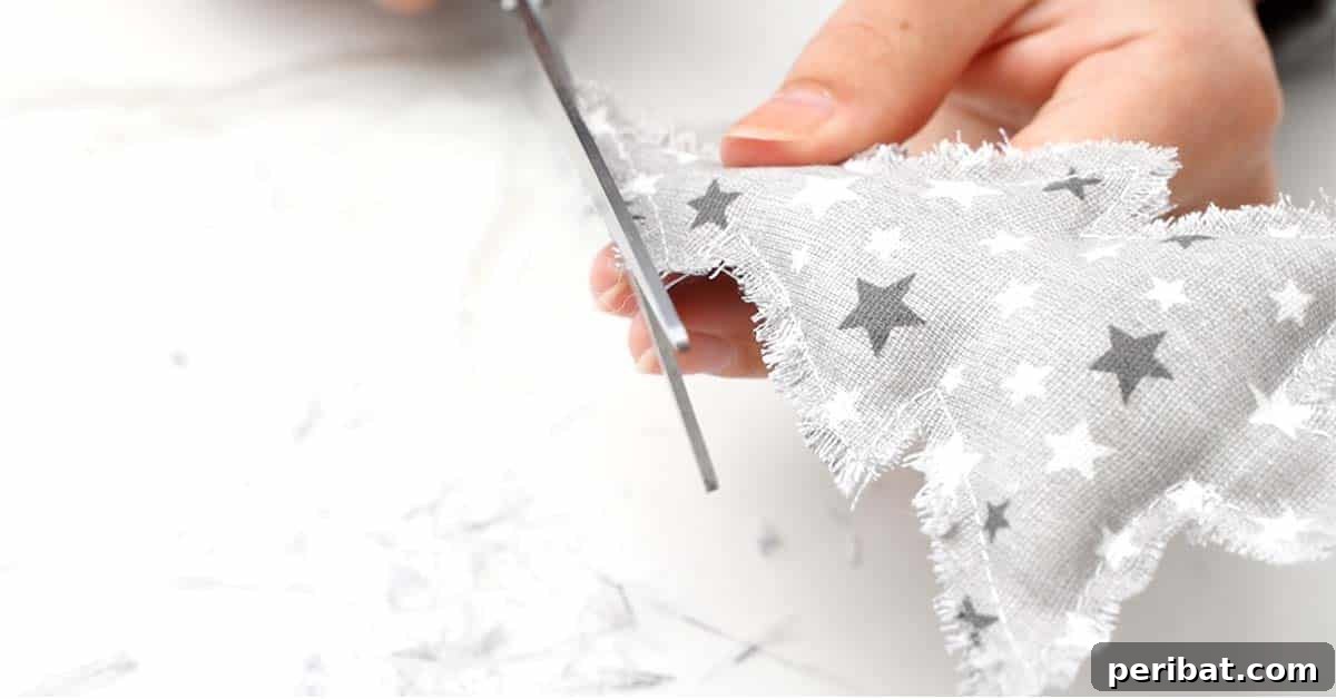 Close-up of a finished DIY Fabric Christmas Tree Ornament with fluffy edges