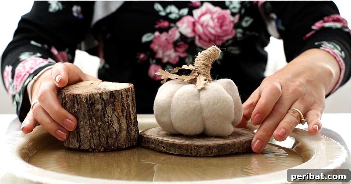 Rustic Autumn Bell Jar Display 6 Arranging the pumpkin and wood slices inside the fall cloche centerpiece