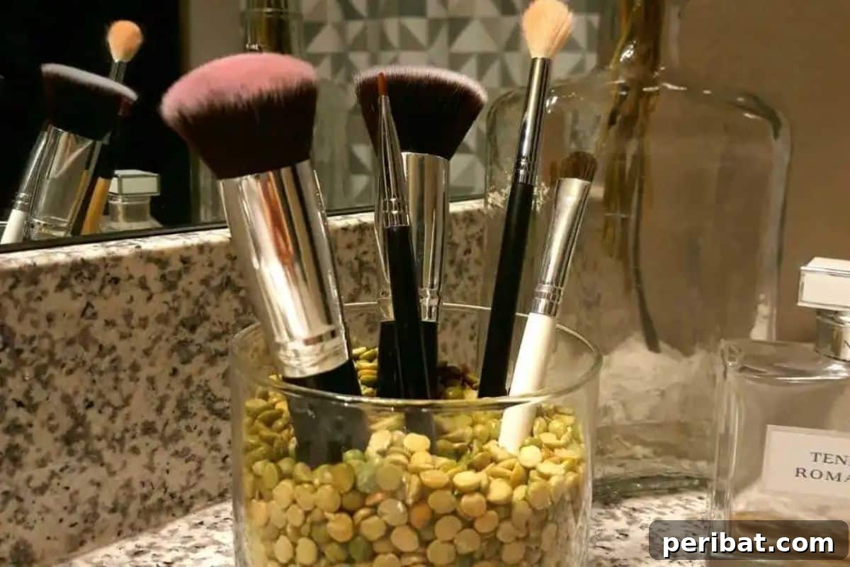 Beyond the Wick: Creative Candle Jar Transformations 14 Makeup Brush Holder with Split Peas