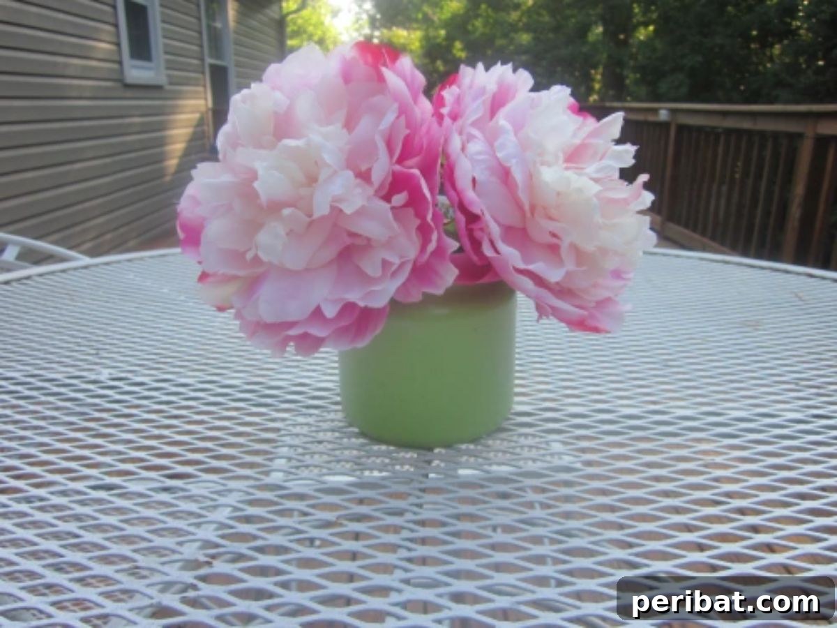 Beyond the Wick: Creative Candle Jar Transformations 17 A candle jar repurposed as a vase.
