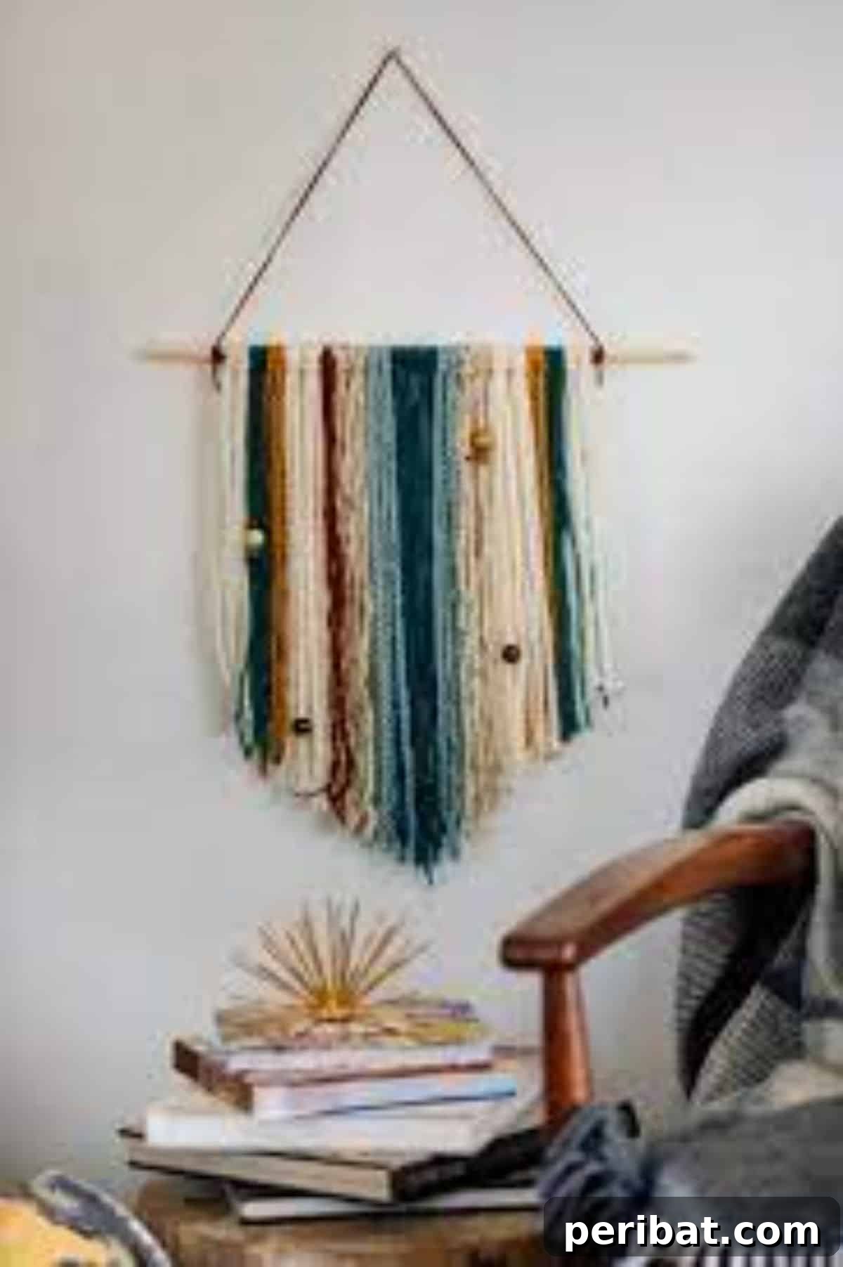 120 Inspiring DIY Boho Decor Ideas and Projects 106 Easy DIY yarn wall hanging with beads, adding texture, color, and elegant design for a subtle yet stylish room makeover.