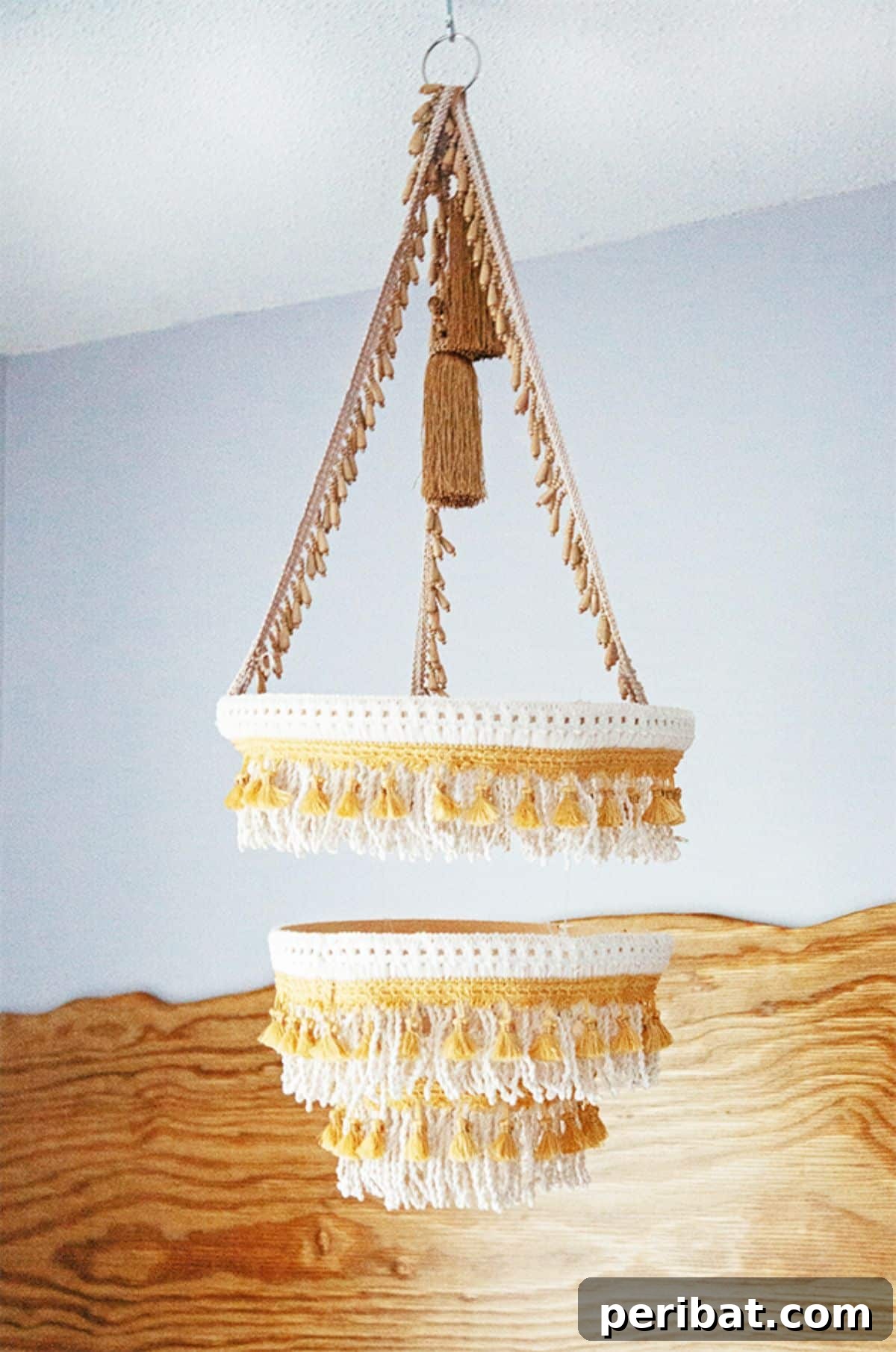 120 Inspiring DIY Boho Decor Ideas and Projects 111 DIY Boho Fringe Chandelier, elevating guest rooms and living spaces with an eclectic mix of crochet, tassels, and beads for a unique lighting fixture.