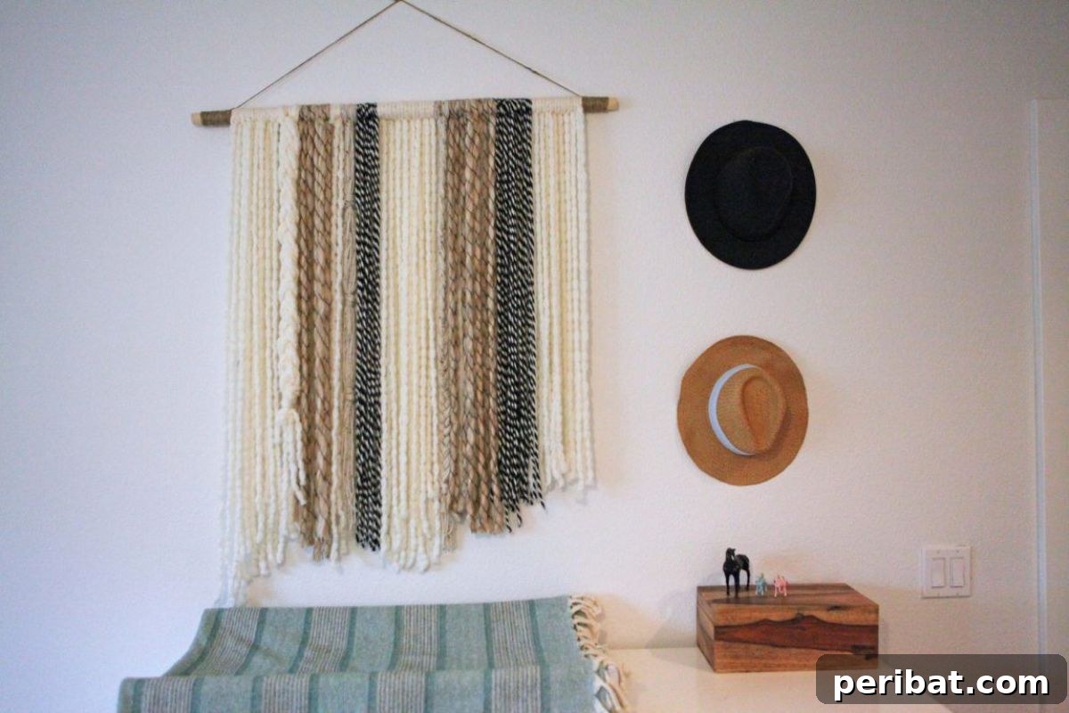 120 Inspiring DIY Boho Decor Ideas and Projects 115 Organic and cozy DIY boho yarn wall art, a heartfelt creation perfect for a nursery or as a keepsake for loved ones.