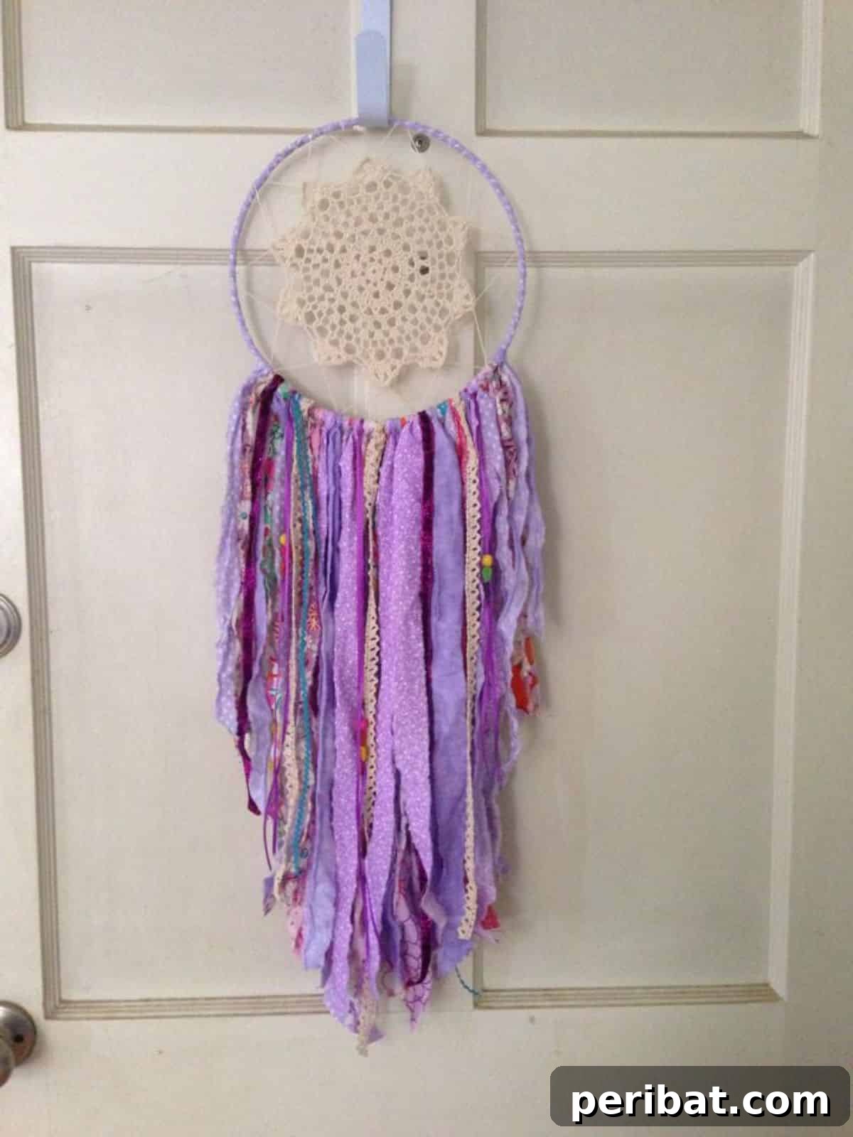 120 Inspiring DIY Boho Decor Ideas and Projects 13 Sentimental and decorative gypsy dream catcher crafted from fabric scraps, perfect for adding color.