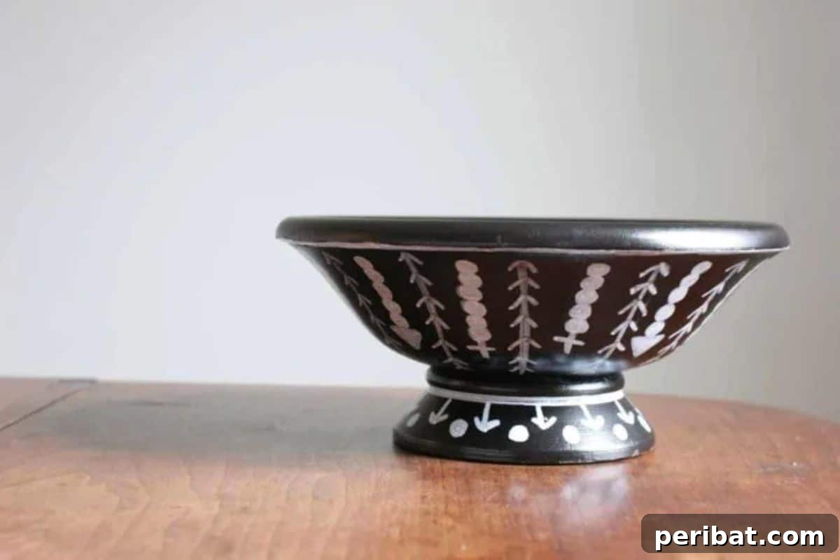 120 Inspiring DIY Boho Decor Ideas and Projects 127 Upcycled DIY tribal wood bowl makeover, transforming a thrift store find into a custom piece of home decor with tribal flair.
