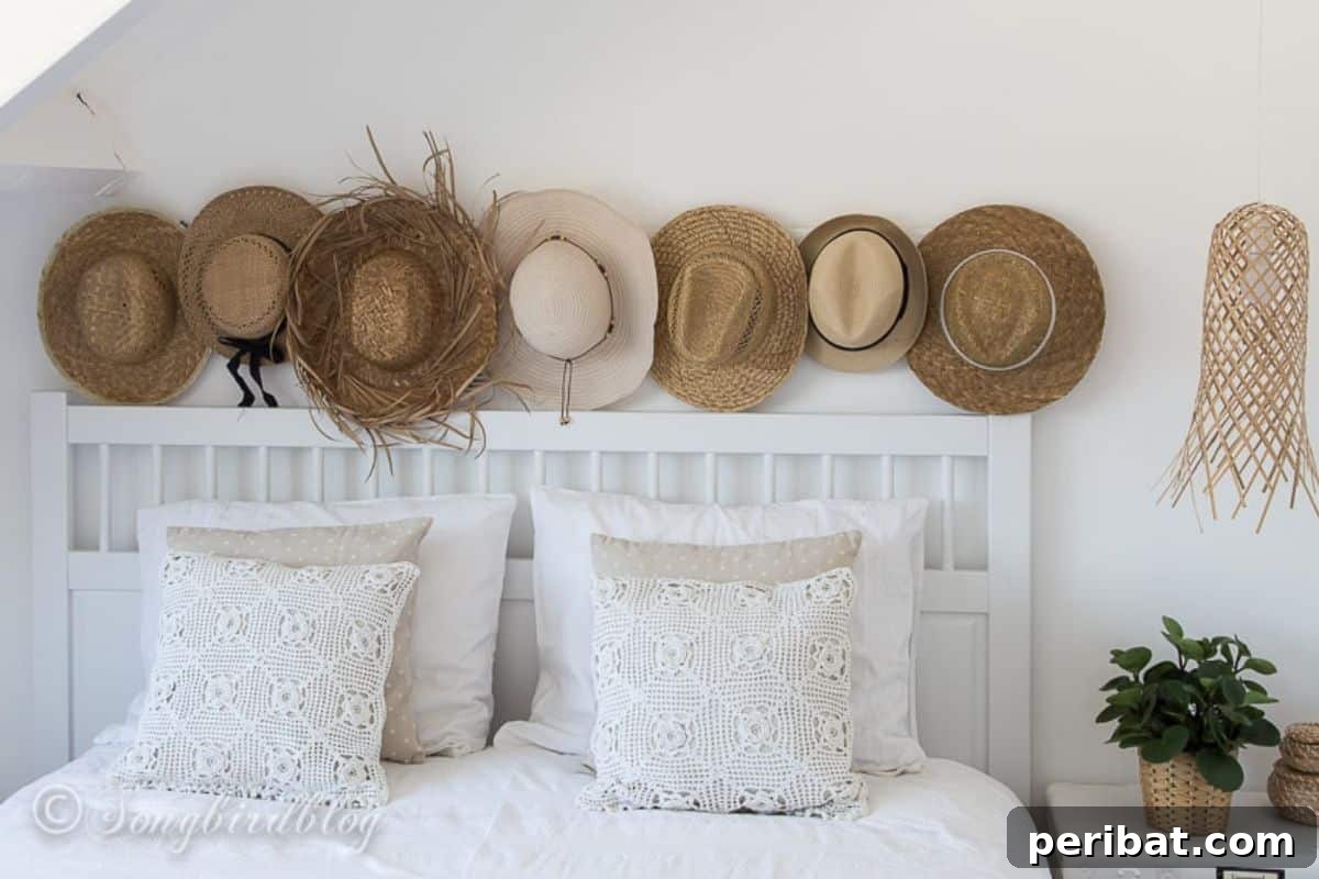 120 Inspiring DIY Boho Decor Ideas and Projects 26 Effortlessly transform a plain room into a white boho bedroom with a serene beachy vibe using straw hats and crochet.