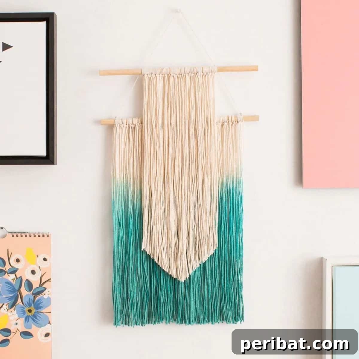 120 Inspiring DIY Boho Decor Ideas and Projects 4 Hand-dyed wall hanging with string, featuring tassels and knots for a unique boho art piece.