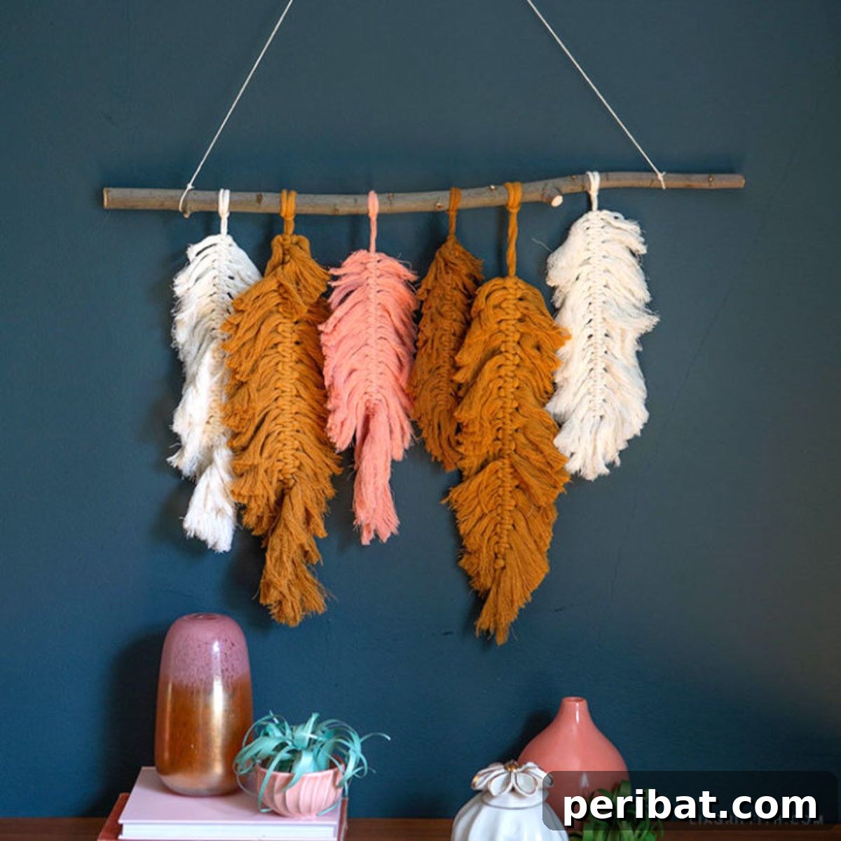 120 Inspiring DIY Boho Decor Ideas and Projects 42 Artistic macramé feather wall decor, bringing a touch of nature and intricate handwork to your living space.