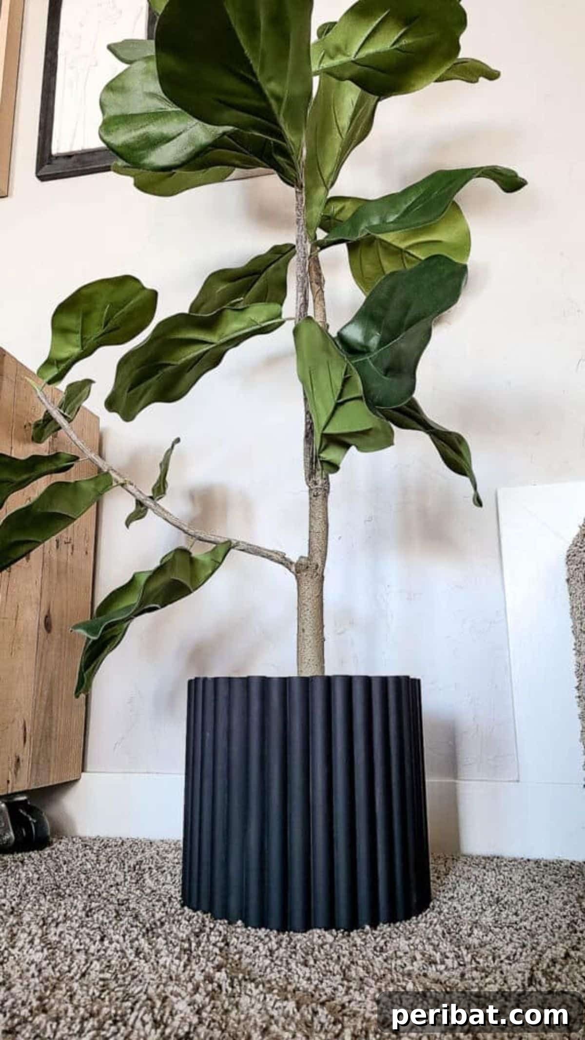 120 Inspiring DIY Boho Decor Ideas and Projects 43 Elegant DIY plant pot cover with fluted texture, elevating home garden aesthetics and mimicking high-end design.