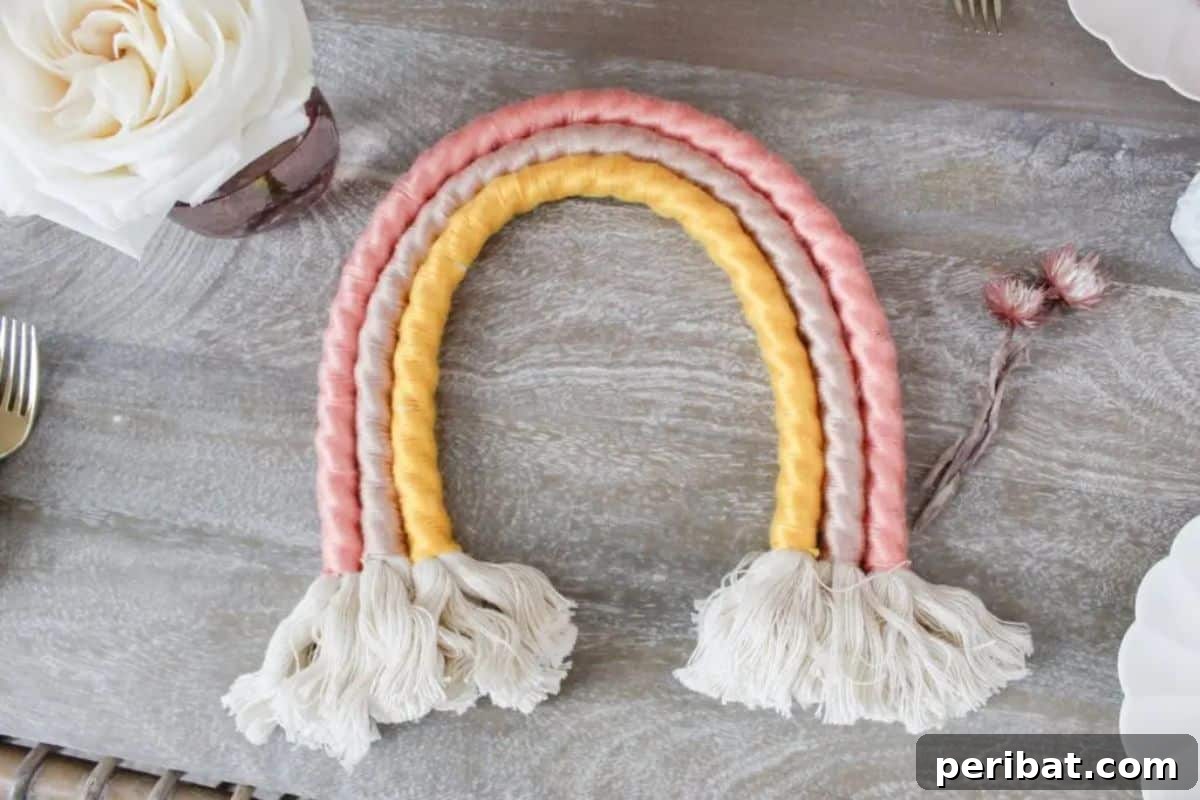 120 Inspiring DIY Boho Decor Ideas and Projects 47 Trendy DIY boho rainbow wall hanging, a colorful, simple, and inexpensive festive touch for kids' rooms or parties.