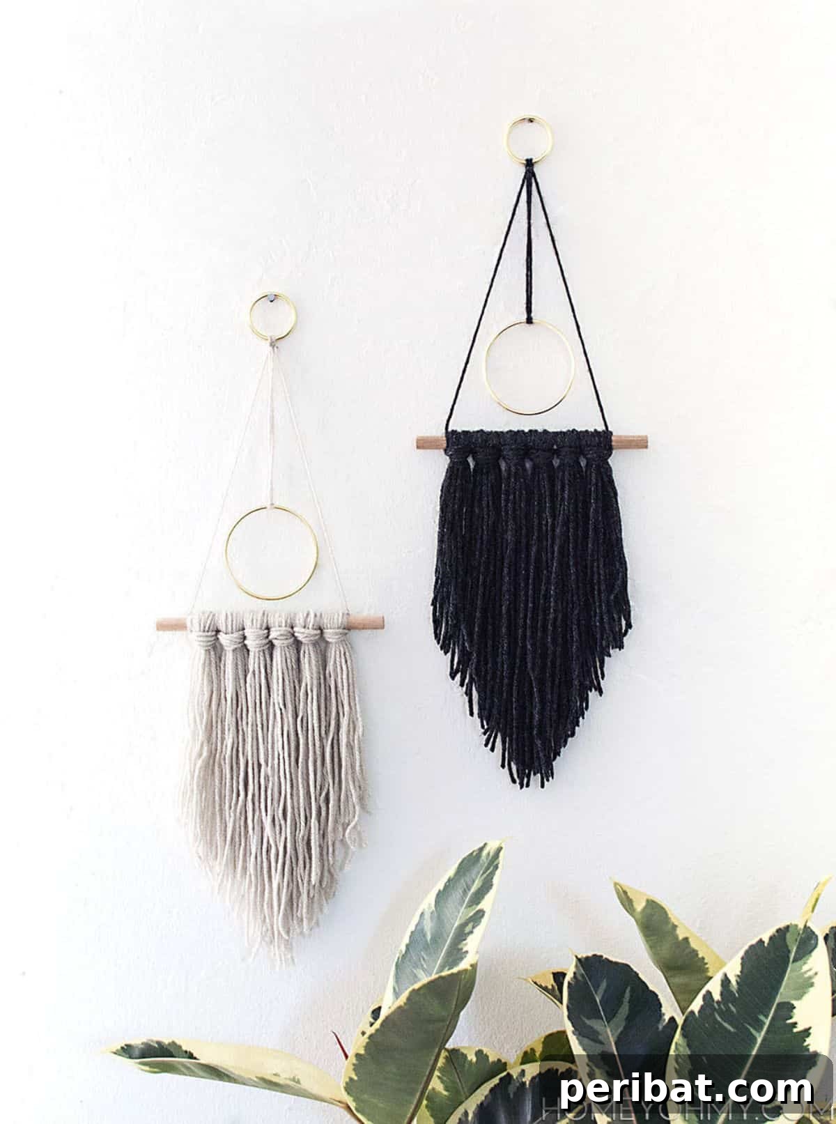 120 Inspiring DIY Boho Decor Ideas and Projects 71 Unique DIY modern yarn hanging with golden rings, inspired by circumstances, creating a unique wall statement.