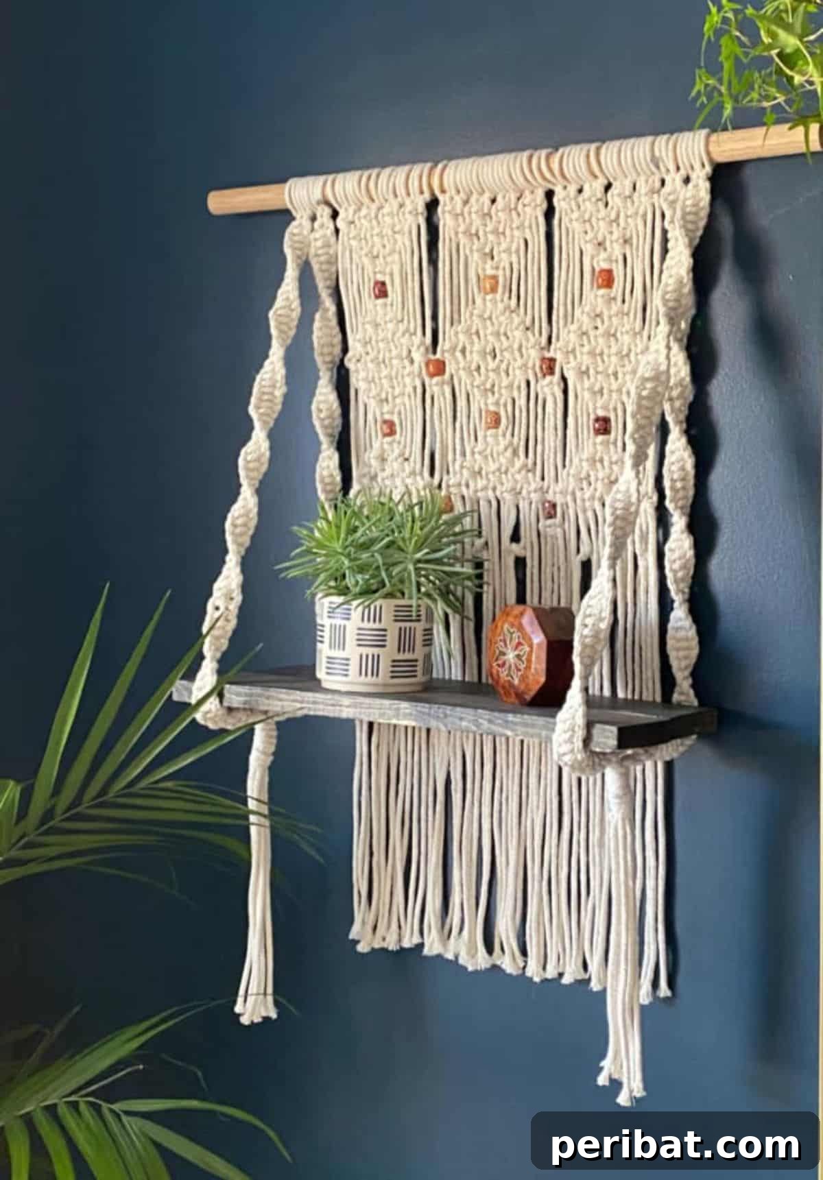 120 Inspiring DIY Boho Decor Ideas and Projects 72 Functional and visually pleasing macramé hanging shelf, blending utility with bohemian flair for any room.