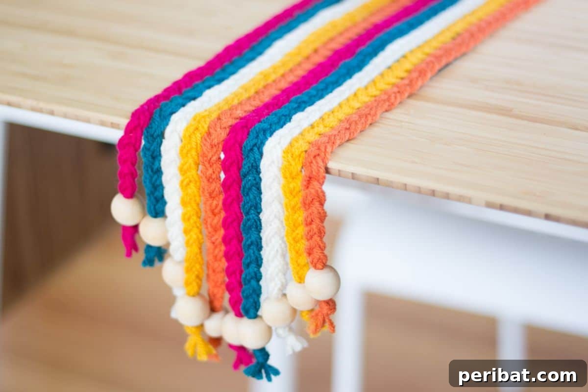 120 Inspiring DIY Boho Decor Ideas and Projects 76 Hand-braided DIY yarn table runner, injecting vibrant hues and refreshing your dining area in a single evening.