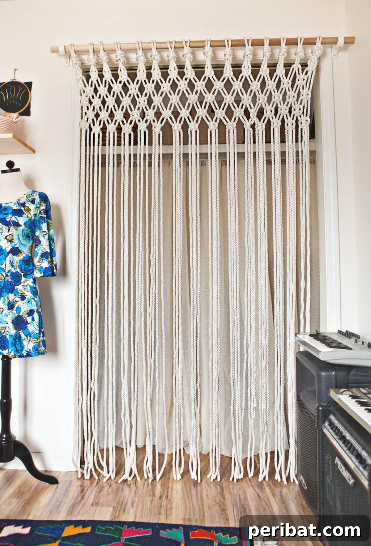 120 Inspiring DIY Boho Decor Ideas and Projects 79 Macramé curtain adding texture and intrigue, a practical alternative to closet doors and eye-catching boho decor.