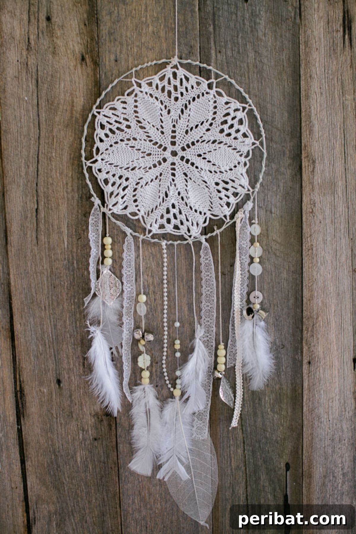 120 Inspiring DIY Boho Decor Ideas and Projects 9 Whimsical DIY wooden dream catcher, perfect for adding a touch of enchantment to any bedroom.
