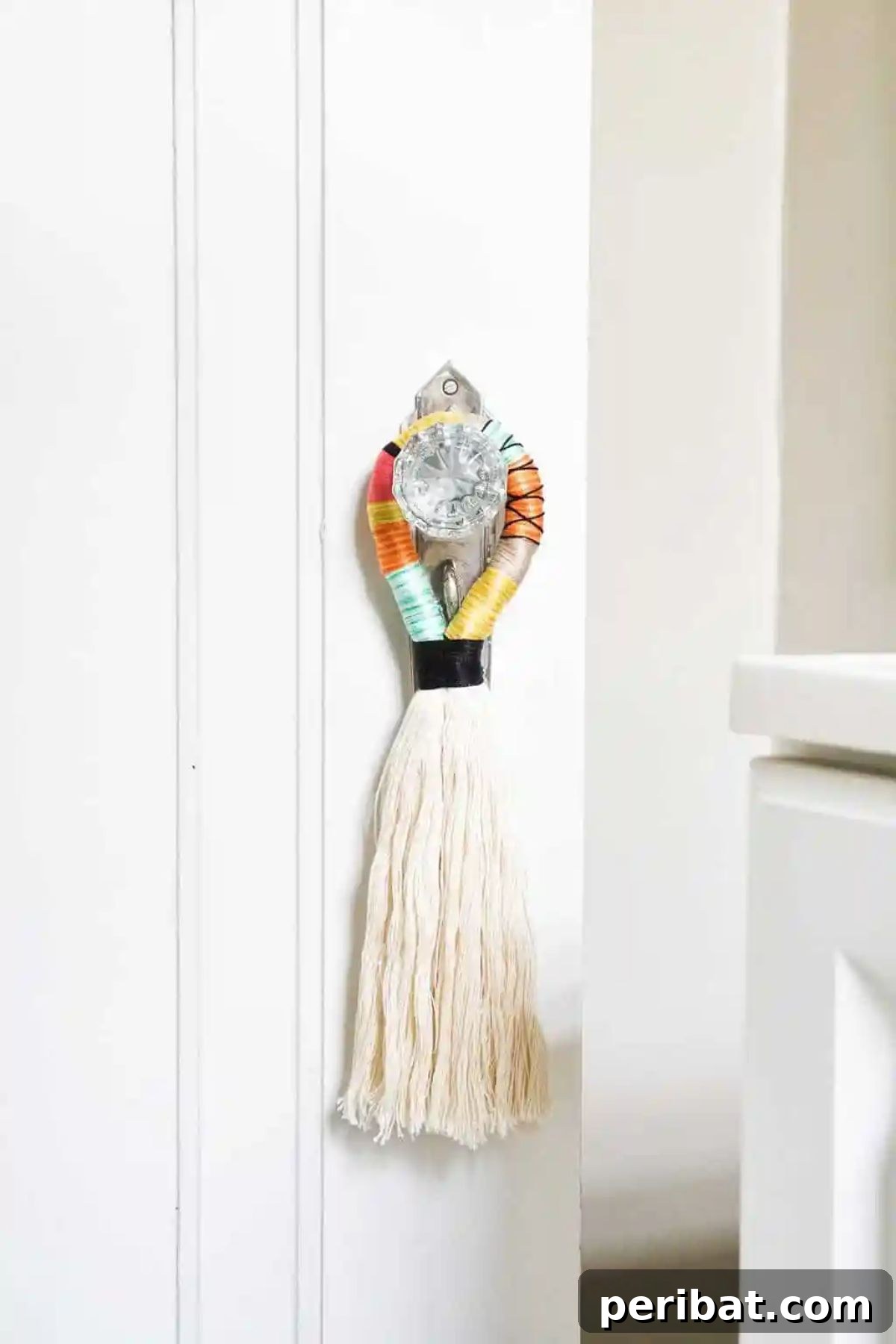 120 Inspiring DIY Boho Decor Ideas and Projects 83 Vibrant DIY door handle tassels inspired by traditional camel swag, breathing new life into mundane spaces with texture and color.