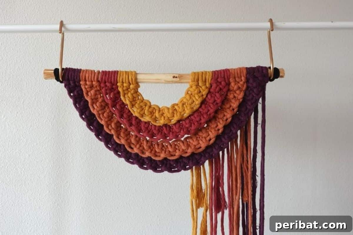 120 Inspiring DIY Boho Decor Ideas and Projects 84 Beginner-friendly macrame rainbow wall hanging, using simple square knots to create a colorful focal point for any room.