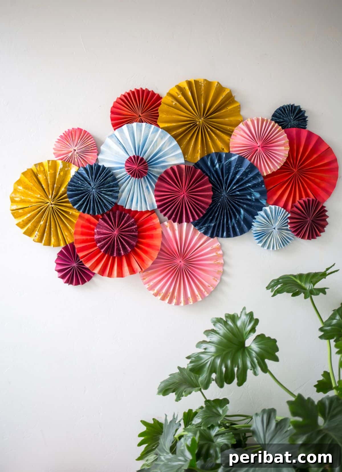 120 Inspiring DIY Boho Decor Ideas and Projects 10 Vibrant layered fan art piece made from cardstock, ideal for adding color and texture to a room.