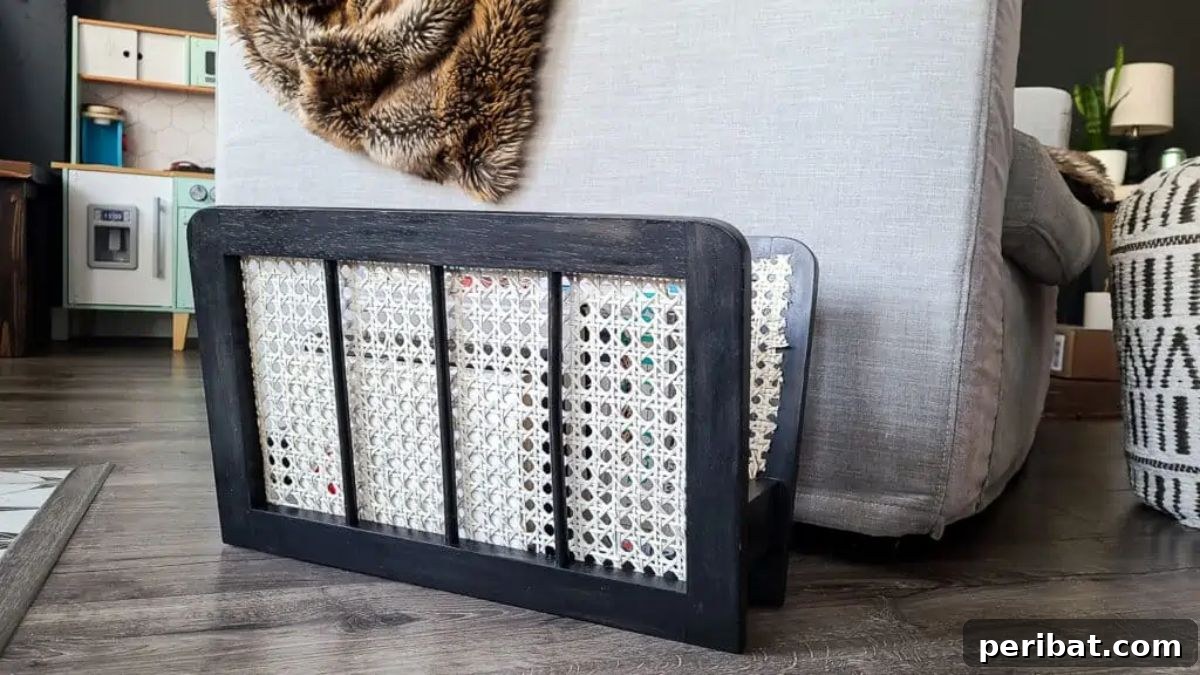 120 Inspiring DIY Boho Decor Ideas and Projects 92 Revamped DIY magazine holder with cane webbing, a creative solution fusing functionality with boho-chic aesthetics.