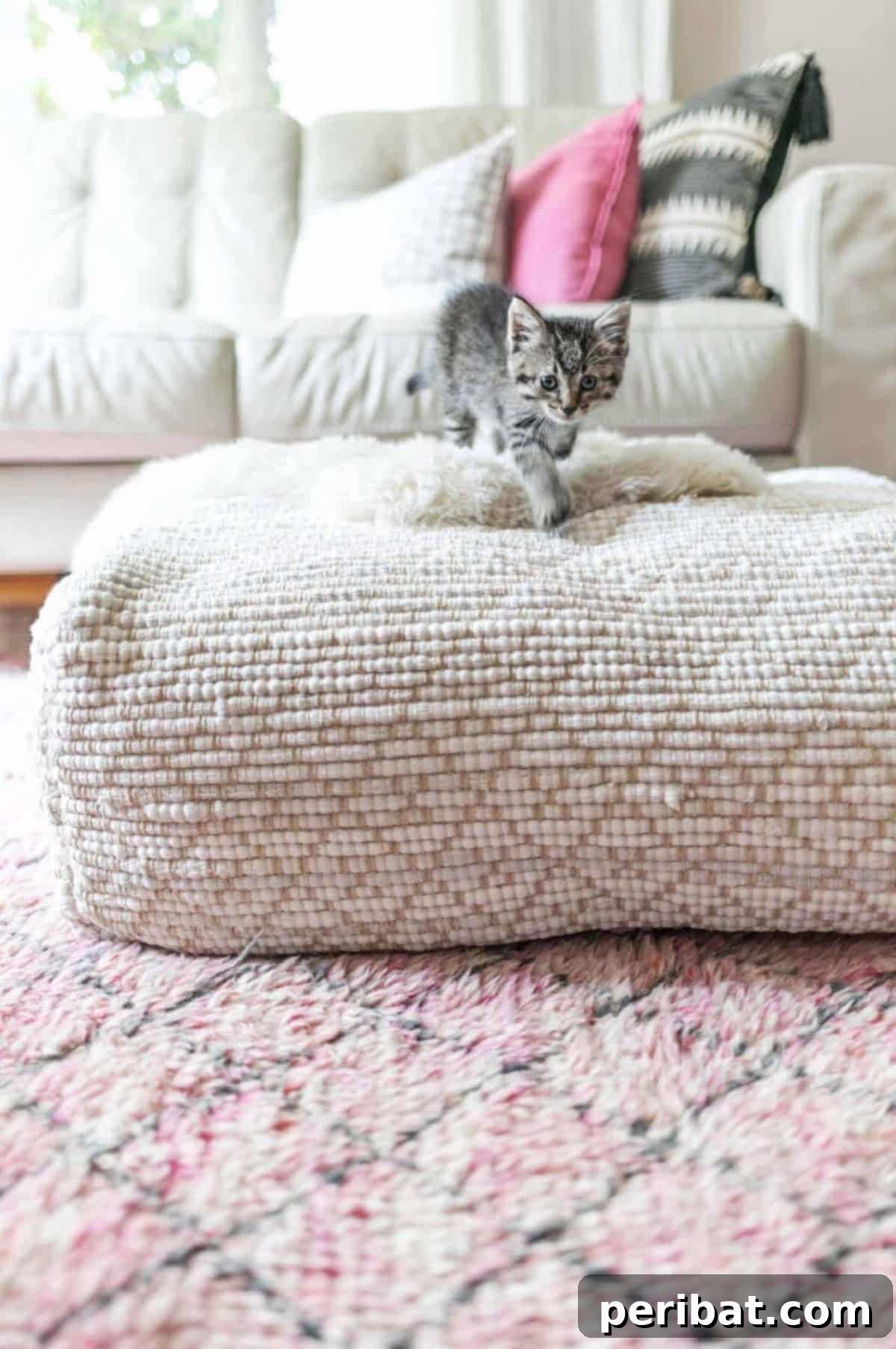 120 Inspiring DIY Boho Decor Ideas and Projects 93 Versatile hand-stitched pouf from woven rag rugs, serving as a comfortable footrest and extra seating in any room with bohemian decor.