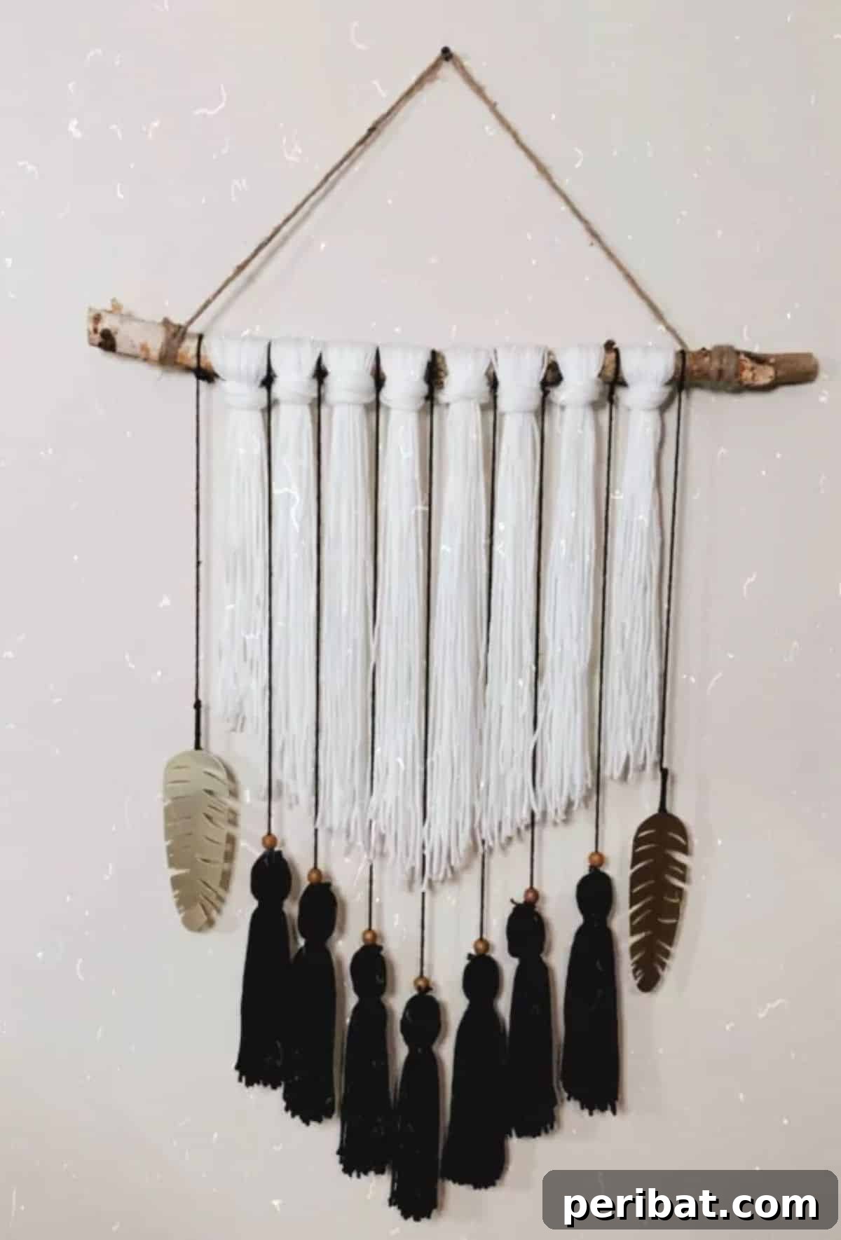 120 Inspiring DIY Boho Decor Ideas and Projects 95 Accessible and stunning DIY boho yarn wall hanging, perfect for adding a budget-friendly focal point to your living room.