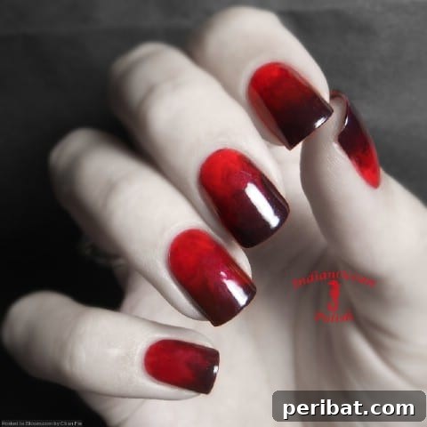 Beautifully blended red and black nails