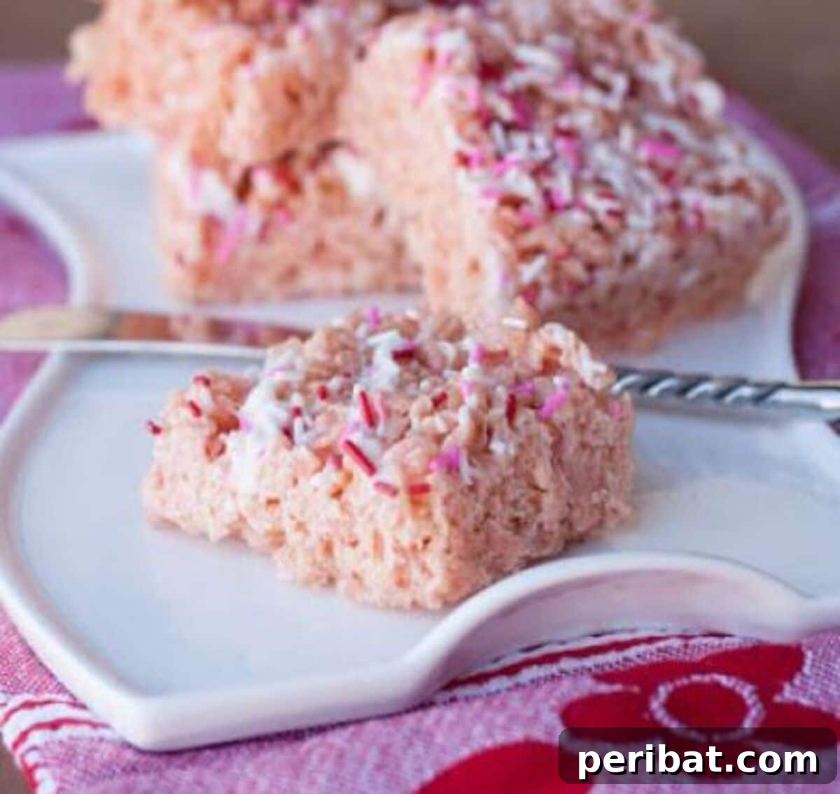 Vibrant Strawberry Cake Batter Rice Krispie Treats, a fruity and fun dessert for any occasion.