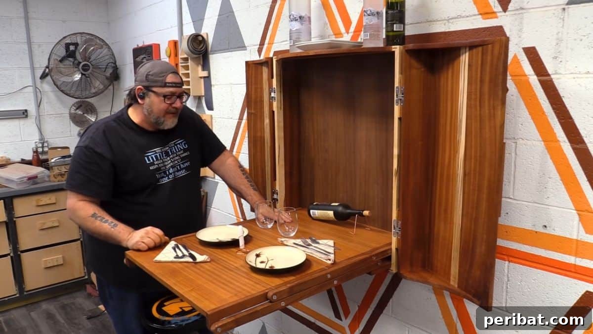 21 Transforming Shelves: Clever Designs for Dynamic Spaces 18 A discreet folding table wall cabinet, concealing a functional table within a sleek wall-mounted unit for optimal space-saving.