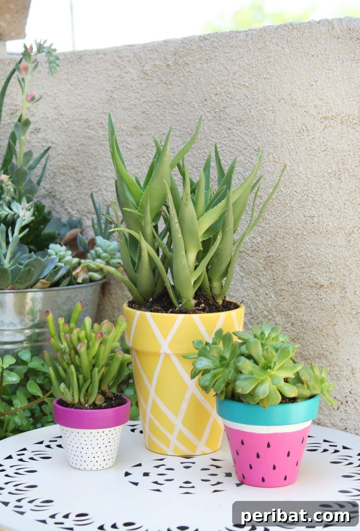 50 Summer DIY Projects to Brighten Your Home 8 Summer Painted Planters