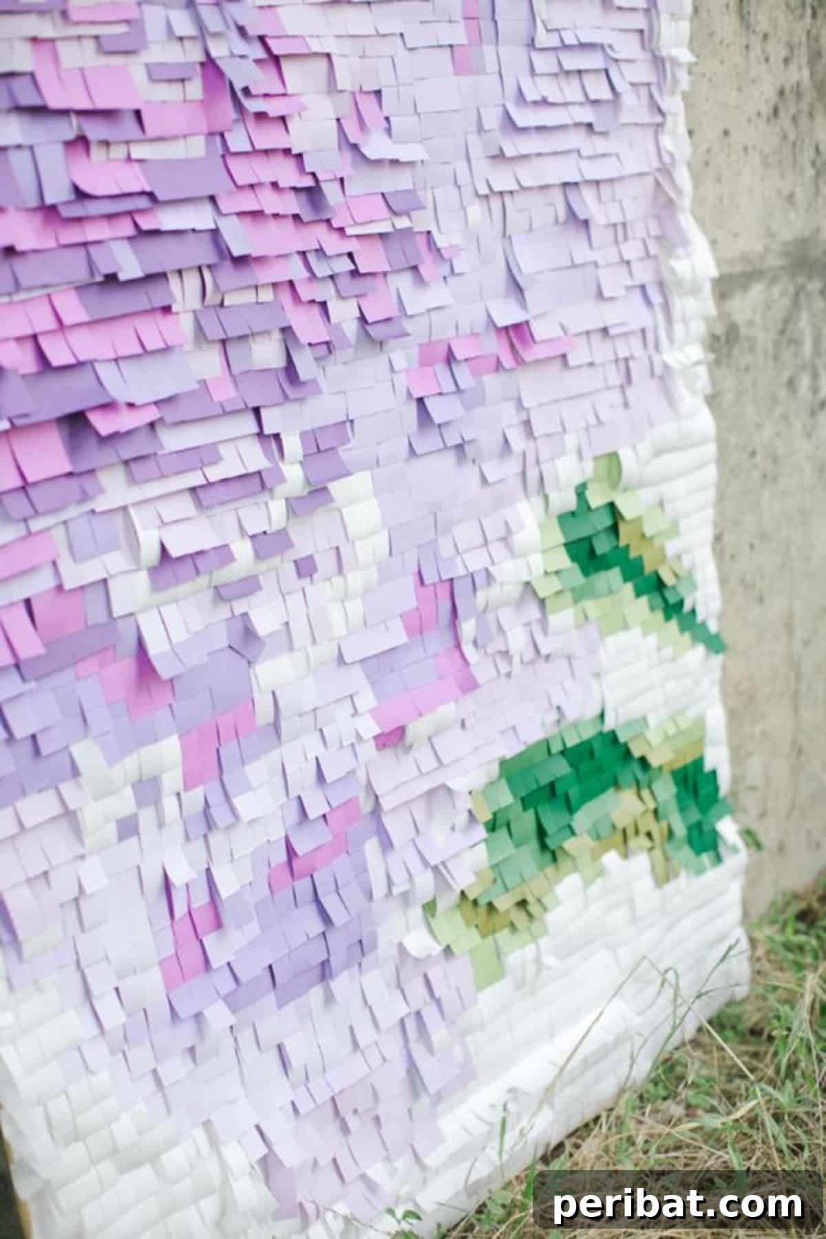 Create a unique pixelated backdrop with colored paper squares for birthday parties
