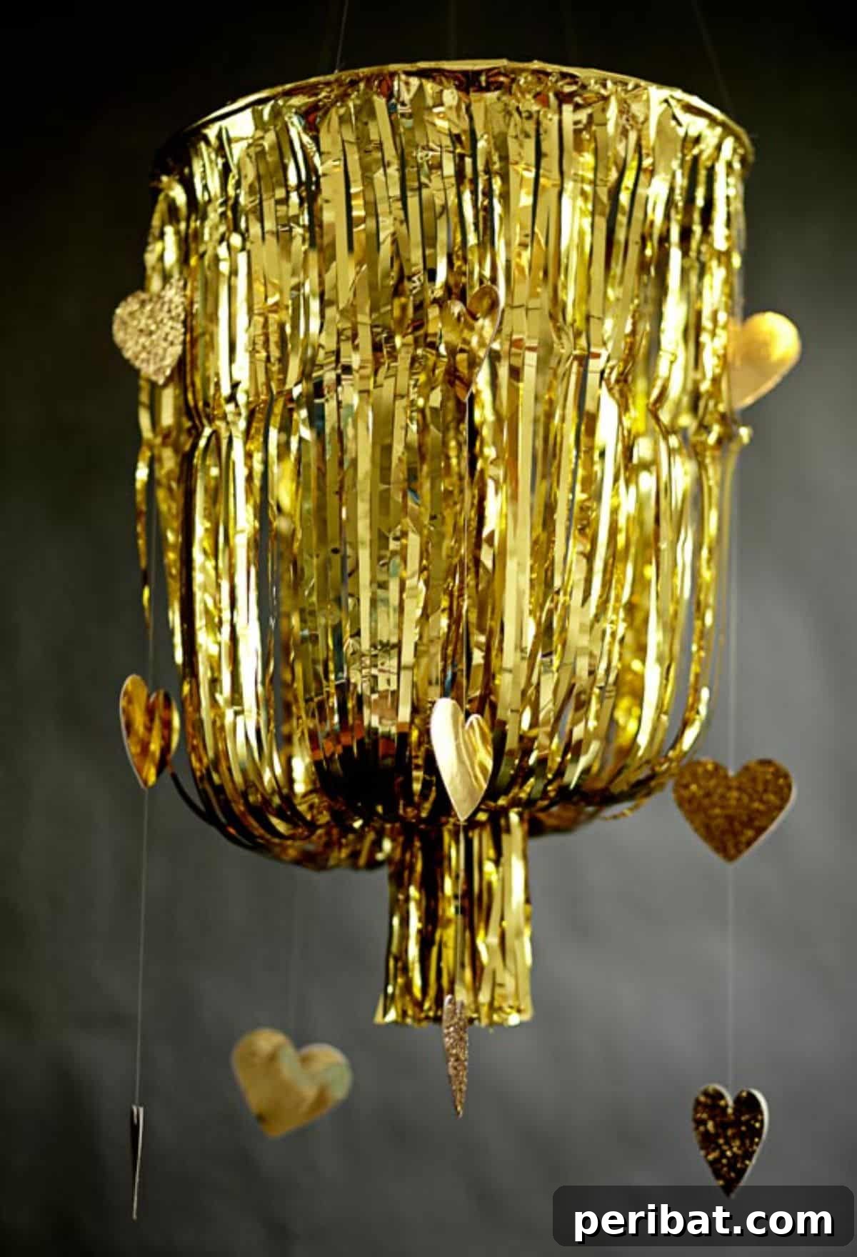 DIY gold fringe chandelier project for luxurious birthday decor