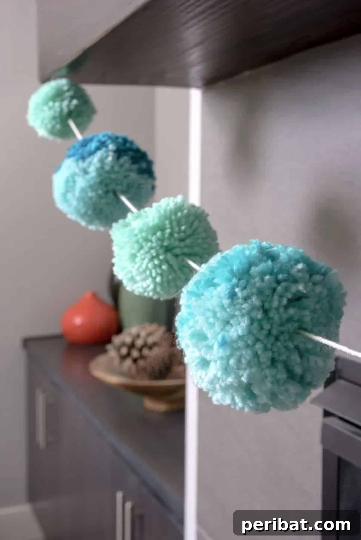 Easy three-step DIY pom pom garland for festive birthday decor