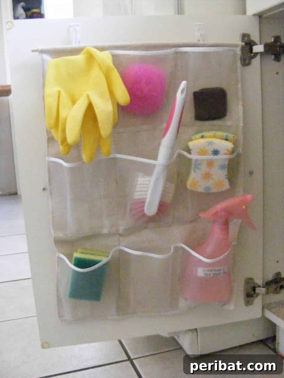 DIY Pocket Organizer, a quick and easy project for neatly tucking away small essentials behind the sink door.