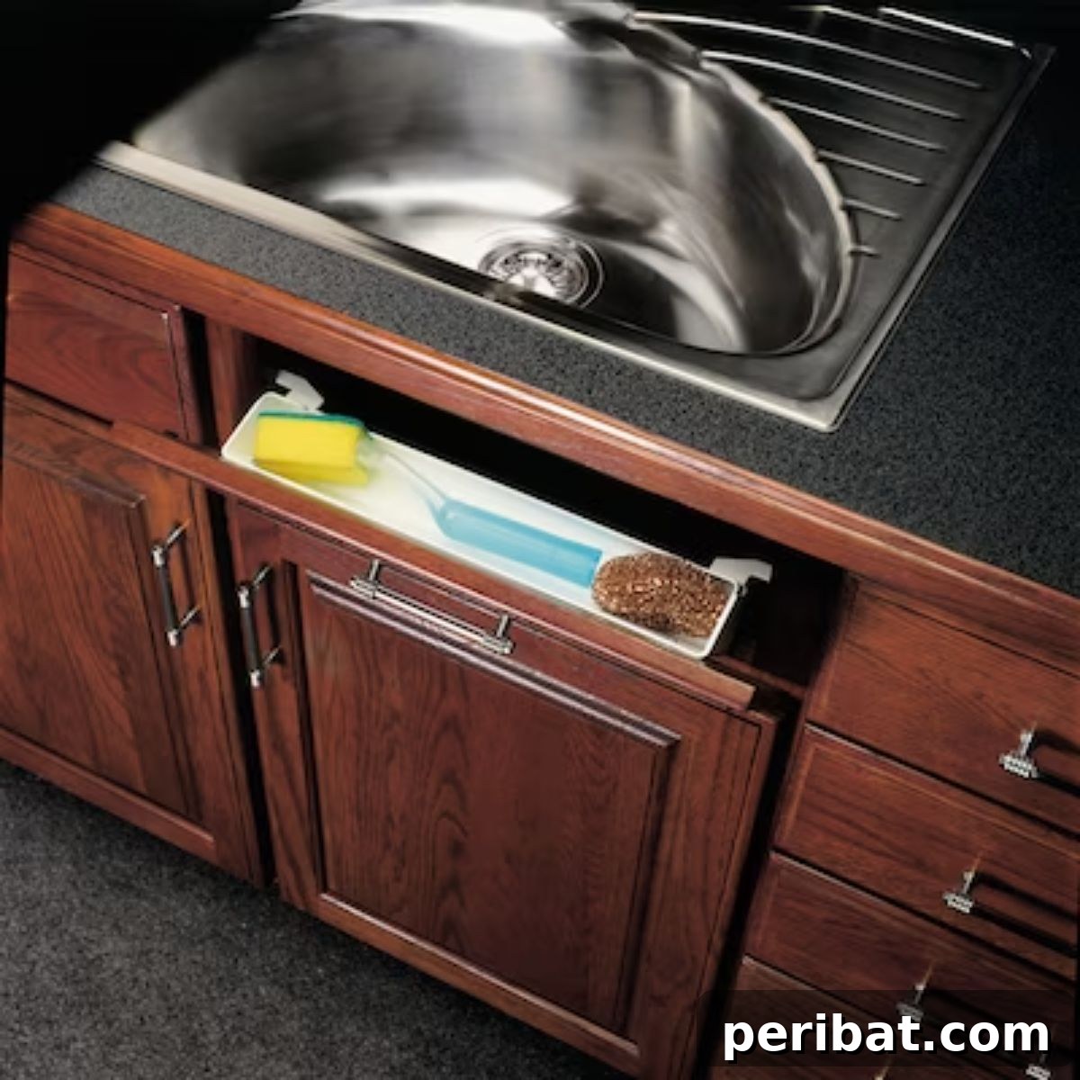 DIY Tip-Out Drawer replacing decorative false fronts for hidden, accessible storage of soap, sponges, and brushes.
