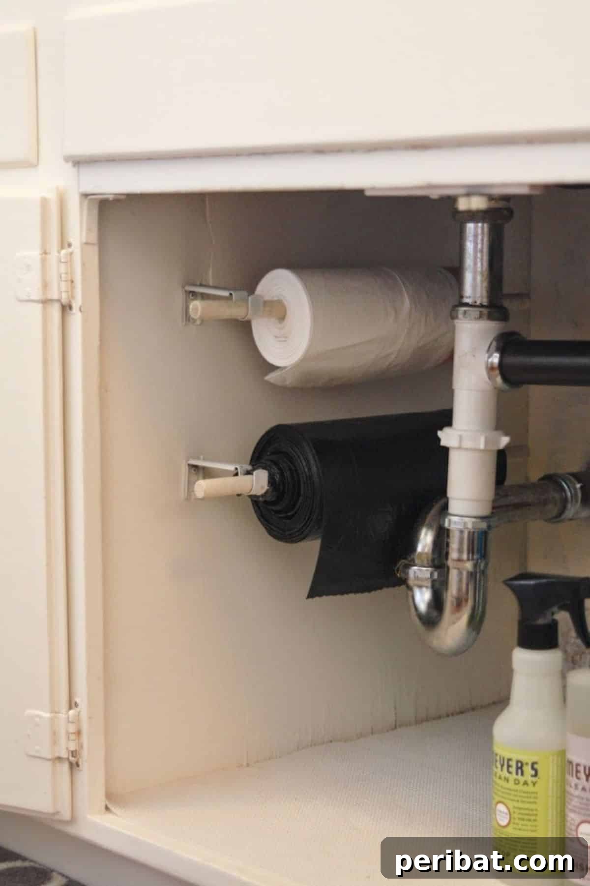 DIY Trash Bags on a Roll for efficient storage and easy access to garbage bags under the sink, reducing clutter.