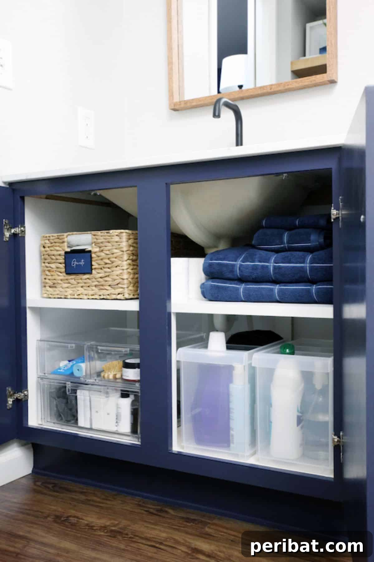 DIY Wooden Shelves maximizing vertical space under the bathroom sink for toiletries, cleaning supplies, and towels.