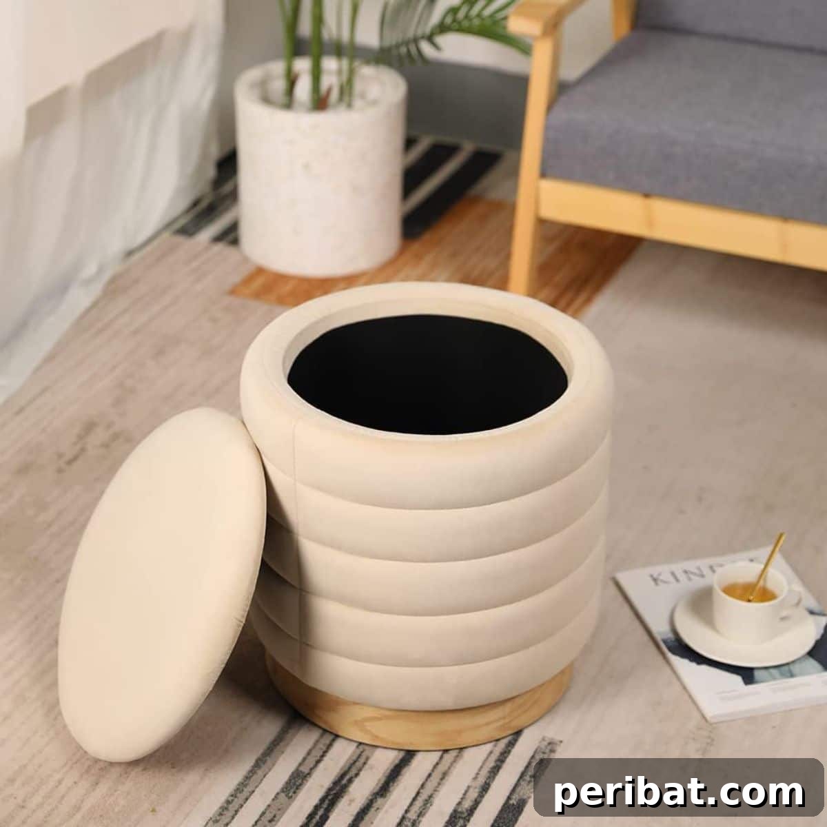 Storage ottoman used as a stylish footstool with hidden storage for blankets or scrapbooks.