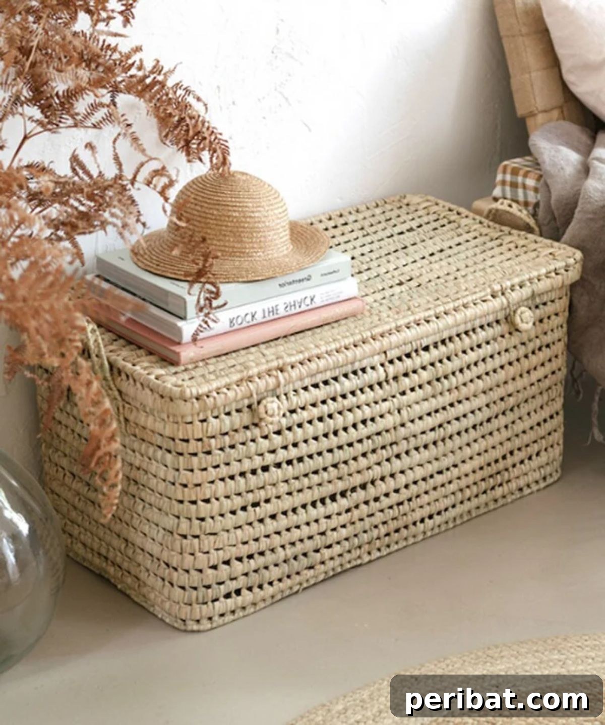 Large woven wicker basket with a lid, perfect for discrete storage.