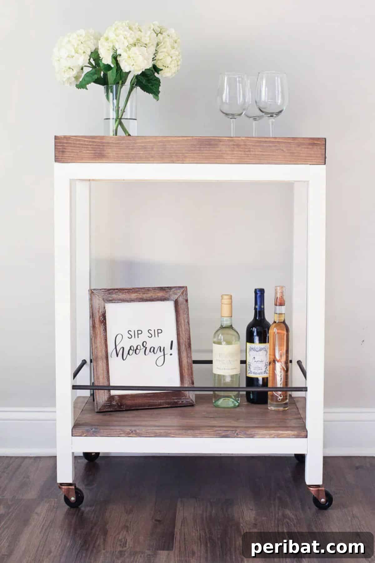 Stylish bar cart repurposed for craft supply storage, showcasing albums and tools.