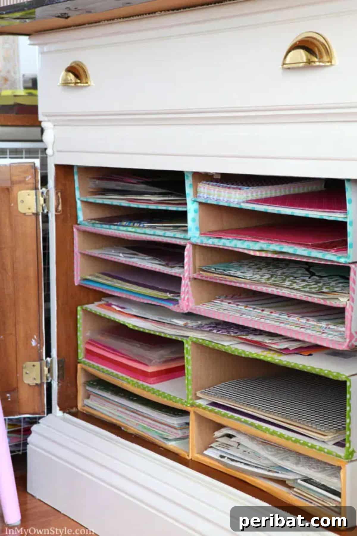 Handmade DIY scrapbook paper organizer with multiple compartments.