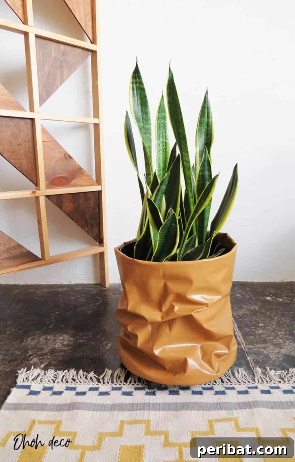 50 Plant Display Ideas: DIY Projects and Product Picks 4 Stylish DIY planter wrapped in faux leather with wheels for easy movement