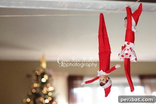 60 Whimsical Elf on the Shelf Display Ideas 44 Ziplining Elf