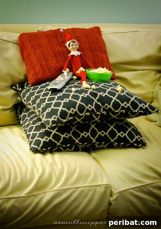 60 Whimsical Elf on the Shelf Display Ideas 58 Watching a Movie