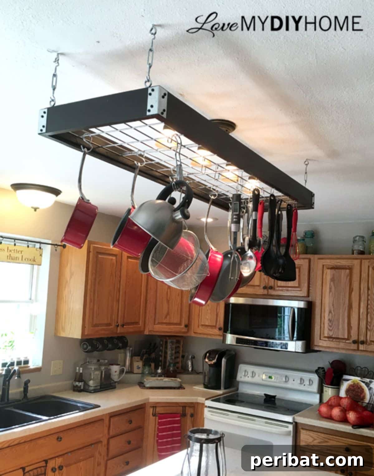 43 Brilliant DIY Pot Rack Projects 12 Space-efficient DIY hanging pot rack under a light fixture for small kitchens.
