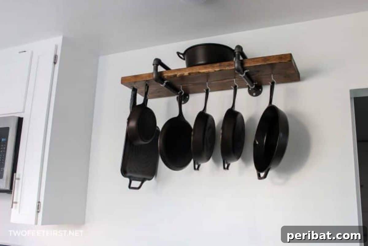 43 Brilliant DIY Pot Rack Projects 22 Robust DIY industrial-style pipe pan rack for cast iron cookware.